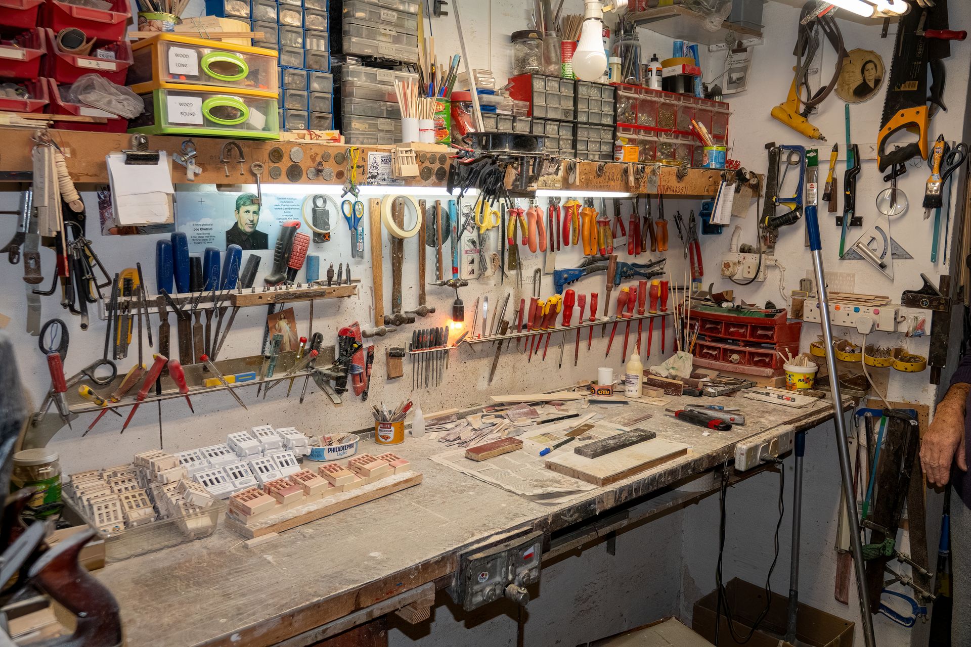 Workshop wall with hand tools, each hanging in its own place